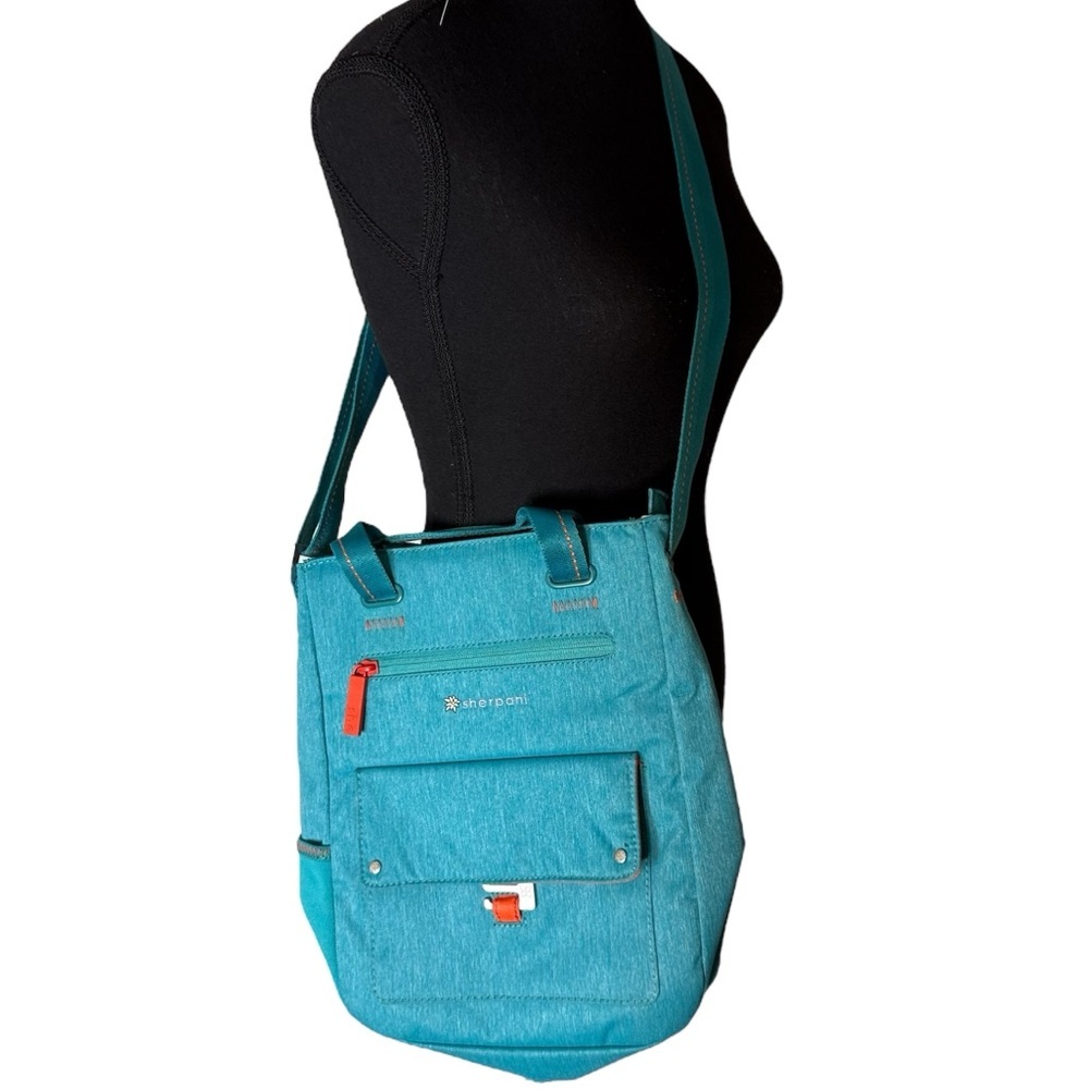 SHERPANI Crossbody Travel Bag Canvas Teal Blue Orange Accents